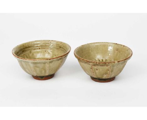 Richard Batterham (1936-2021)a pair of cut-sided stoneware footed bowls, covered in an ash glaze, one with chatter band to in