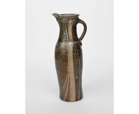 Φ Michael Casson (1925-2003)a tall stoneware ewer, swollen cylindrical form with applied handle, simple brushed design in mus