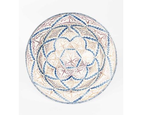 A large Wedgwood Pottery charger by Louise Powell, pattern no. 4756, painted to the well with panels of stylised foliage the 