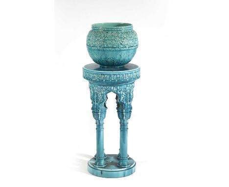 A Clement Massier pottery jardiniere stand and matched Burmantofts jardiniere, the circular base with four cylindrical column