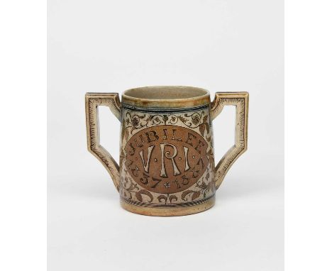 A Martin Brothers stoneware commemorative Queen Victoria's Jubilee loving cup by Robert Wallace Martin, dated 1887, cylindric