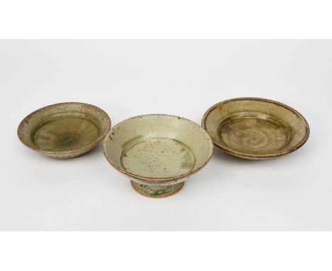 Richard Batterham (1936-2021)a small stoneware tazza, covered in an ash glaze, and two graduated stoneware plates, one with a