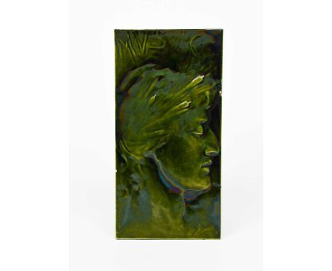 Music a rare tile plaque designed by Sir George Frampton, modelled in low relief with a male classical portrait, glazed green