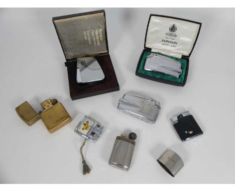 A collection of vintage pocket lighters, to include examples by Zippo, Ronson and Orbit.