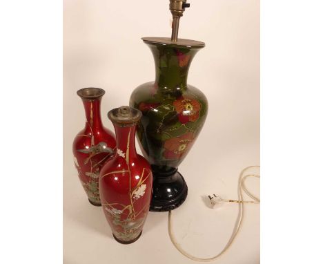 A pottery table lamp, decorated with birds and flowers, mounted to an ebonised wooden plinth, h.40cm; together with a pair of