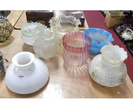 An acid etched cranberry glass oil lamp shade, h.19cm; together with six other oil lamp shadesCranberry glass shade – a few l