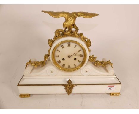 An early 20th century French mantel clock, surmounted by a gilt metal eagle clutching a snake, the dial having applied Roman 