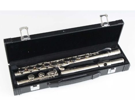 A Slade flute, housed in a fitted case, together with a Donner folding sheet music stand with adjustable lights, in travel ba