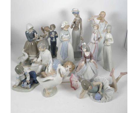 A collection of porcelain figures to include a Lladro figure of a bride and groom,height 20cm, various other Lladro and Nao f