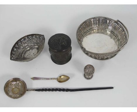 A Georgian toddy ladle, the bowl set with a sixpence, having a whalebone handle, together with an Anglo-Indian white metal di