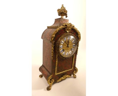 An early 20th century French gilt metal mounted boulle work mantel clock, having an eight-day movement striking on a bell, h.