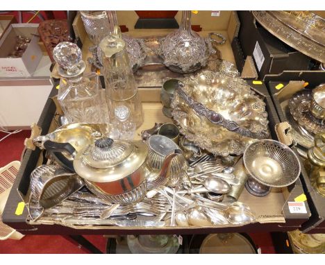 A collection of sliver plated wares to include a teapot, a helmet shaped sauceboat, flatware etc.