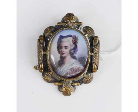 A painted porcelain miniature portrait brooch, in gilt metal mount, 5.5 x 4cm 