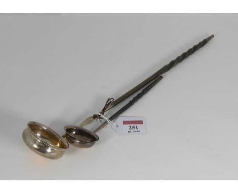 A Georgian silver toddy ladle, having a turned whalebone handle, marks rubbed, together with another similar (2), largest 38c