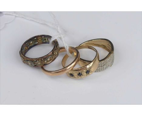 A 9ct gold sapphire set three-stone ring; together with three other 9ct gold rings, being a wedding band, diamond point half-