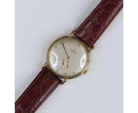 A circa 1950 gent's Omega 9ct gold cased wristwatch, having signed silvered Arabic dial, subsidiary seconds dial, Cal.194 man