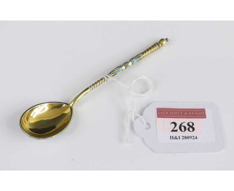 A continental silver-gilt and champleve enamel decorated coffee spoon, 13.9gLight scratches to bowl.  Slight wear and handlin