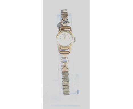 A lady's MuDu 18ct gold cased manual wind wristwatch, having signed silvered dial, case dia.16mm, on associated expanding lin