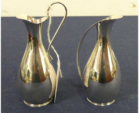 A pair of Danish white metal miniature ewers, each stamped HF Danmark, 3.7oztVery light scratches visible with a lens.Little 