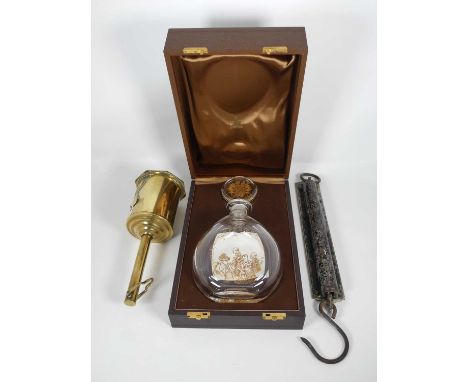 A commemorative Churchill centenary collection glass decanter, boxed, together with a brass roasting jack and spring balance 