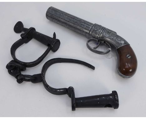 A replica Allen &amp; Thuber six shot pepper pot revolver, together with a pair of reproduction handcuffs