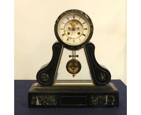 A 19th century slate and variegated marble mantel clock, of drumhead form, the enamelled dial having a visible escapement, sh