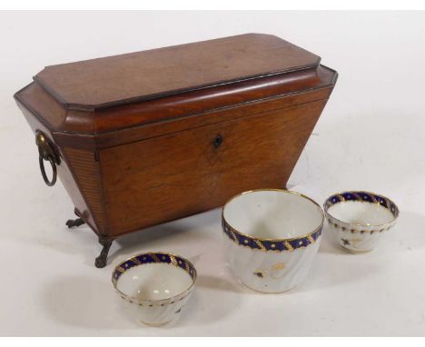 A 19th century mahogany and satinwood inlaid tea caddy, of sarcophagus form w.35cm; together with two 18th century Worcester 