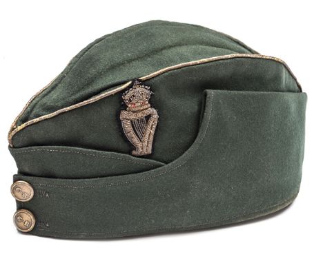 An officer’s green cloth sidecap of The Connaught Rangers, gilt piping, embroidered crowned harp badge, flat buttons bearing 