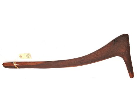 An Australian Aboriginal hardwood hunting stick, in the form of a flat figure “7”, with panelled grooved decoration overall o