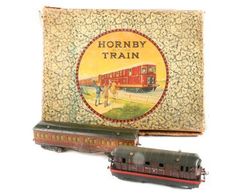 A Hornby O Gauge 20V electric Metropolitan Train set. Comprising a 3-rail Metropolitan Railway 0-4-0 locomotive, in gold line