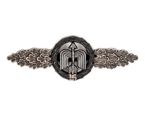 A Third Reich Luftwaffe Night Fighter clasp, by R.K. (R Karnath), with silver leaves and black wreath. GC (the back slightly 