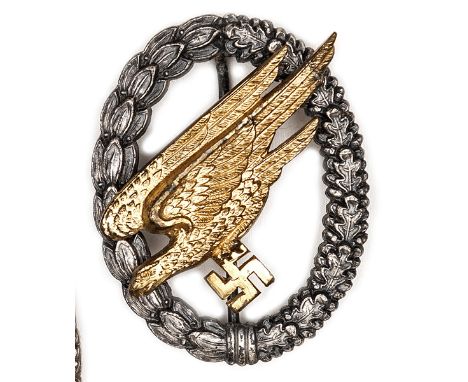 A good Third Reich Paratrooper’s badge,  by G H Osang, Dresden, with gilt eagle and oxidised silver wreath, the hook and hing