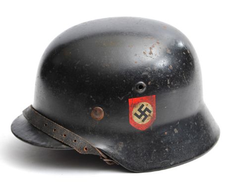 A Third Reich M35 double decal steel helmet, the black semi matt finish with party decal and added early type SS decal, stamp