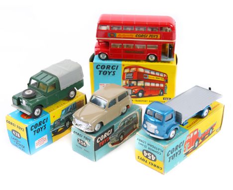 4 Corgi Toys. Hillman Husky (206) in fawn, with smooth spun wheels. Land Rover 109" W.B. (438) in dark green with yellow inte