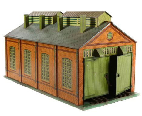 A 1935-41 large Hornby O gauge tinplate double ended three rail, two track engine shed No2E. With brick and tiled effect fini