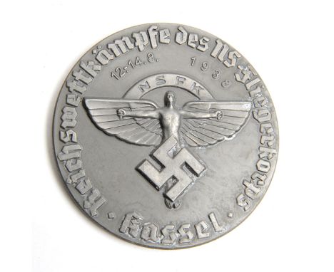 A Third Reich NSFK non portable award, of light weight, bearing the NSFK winged man emblem, the date “12-14.8.1938” and inscr