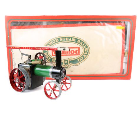 2 Mamod live steam items. ‘The Mamod Steam Railway RS1’. Comprising 0-4-0 tank locomotive in dark green and black livery, wit