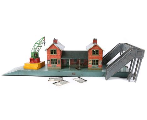 A small quantity of O gauge model railway accessories. A Bing British outline line side station in the style of a traditional