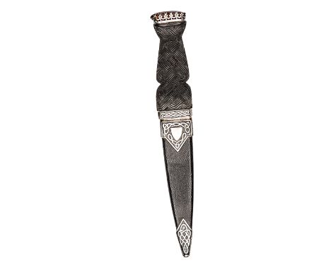 A similar skean dhu, blade 3½”, scalloped and lined along half of the back edge, darkwood grip with strapwork to outer face a