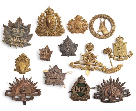 10 Commonwealth cap badges, including Vic Canadian slouch hat, RCMP (one lug replaced), Malta Artillery large cannon, RWAFF, 