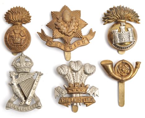 3 Irish cap badges: R Inniskilling flag right, R I Rifles WM, Leinster square scrolls; 3 all brass caps: Cheshire, R Welsh F 