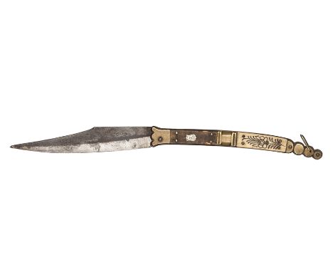 A Spanish folding knife Navaja,  blade 7” marked “Toledo” in oval on one side, brass panelled grip with horn and floral carve
