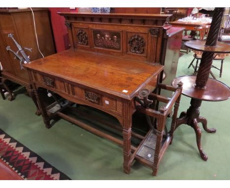 An Arts & Crafts oak/ash hall table with inset embossed copper panel to back and matching handles, stick stands to either sid