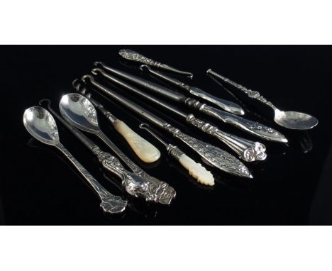 A quantity of mother of pearl and silver handled button hooks, silver spoon and associated items 