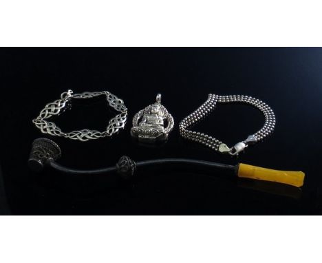 A Celtic knot panel bracelet stamped 925, a filigree pipe, Eastern pendant of a deity stamped 925B and a bracelet (4)