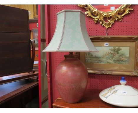 A ceramic table lamp with crackle glazed design, green shade