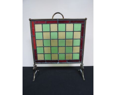 A brass frames stained glass fireguard 
