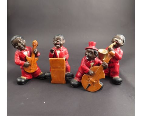 Four ceramic jazz band figures