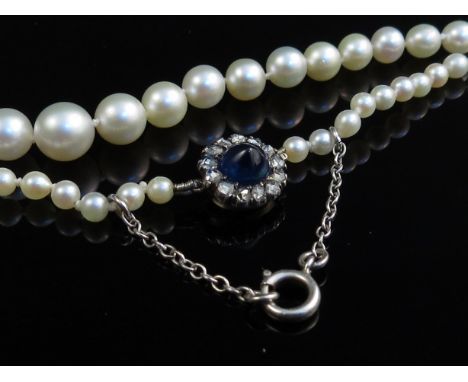 A single strand graduated pearl necklace with cabochon sapphire and old cut diamond set clasp 