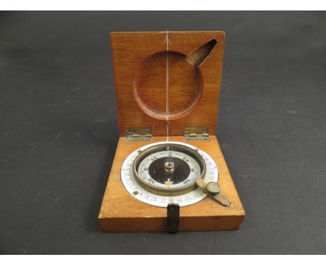A compass in wooden case, dated 1918